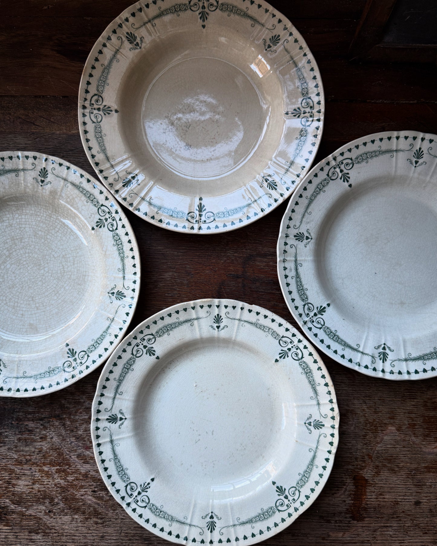 Four pretty vintage French side plates