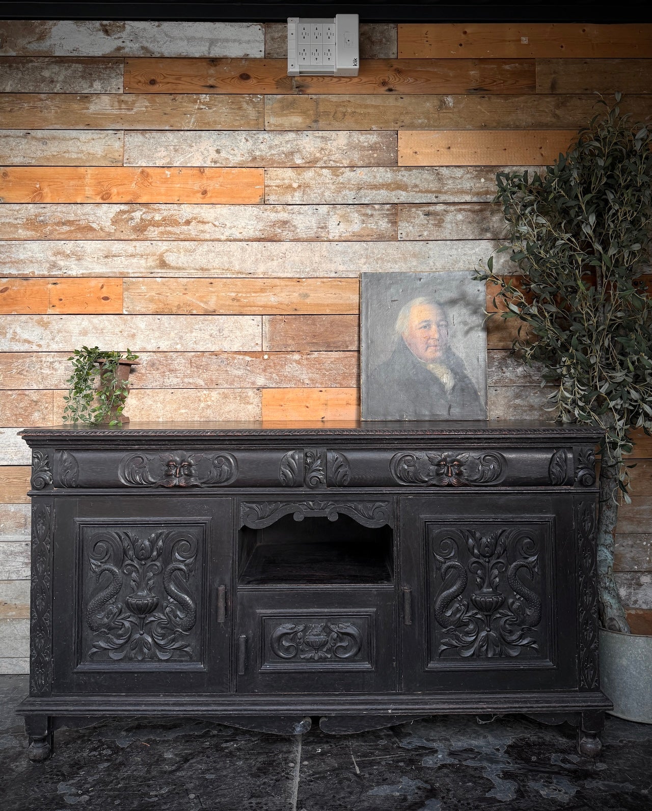 Heavily carved Victorian ebonised sideboard