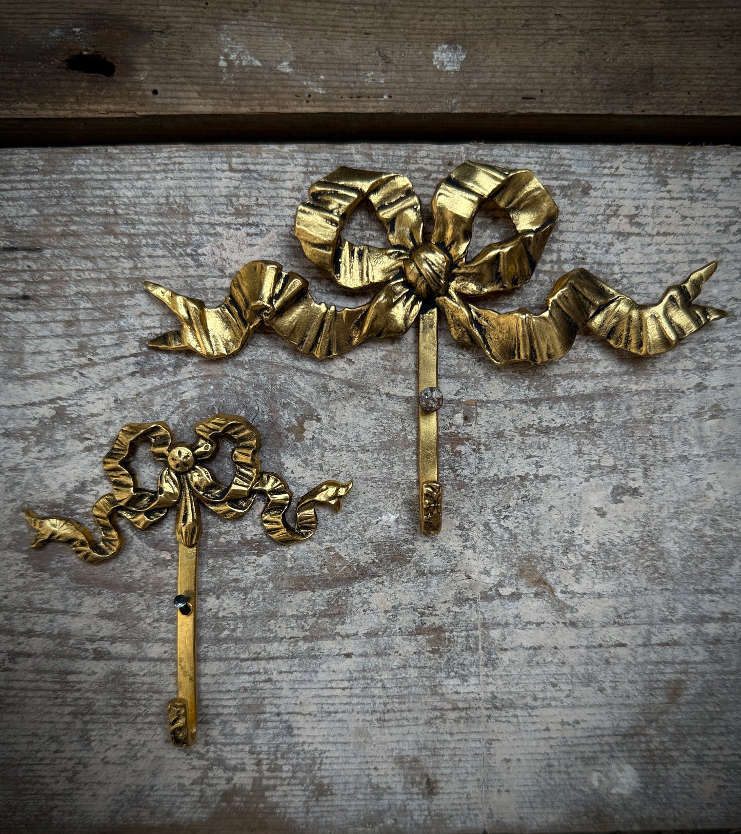 Small vintage French bow hooks