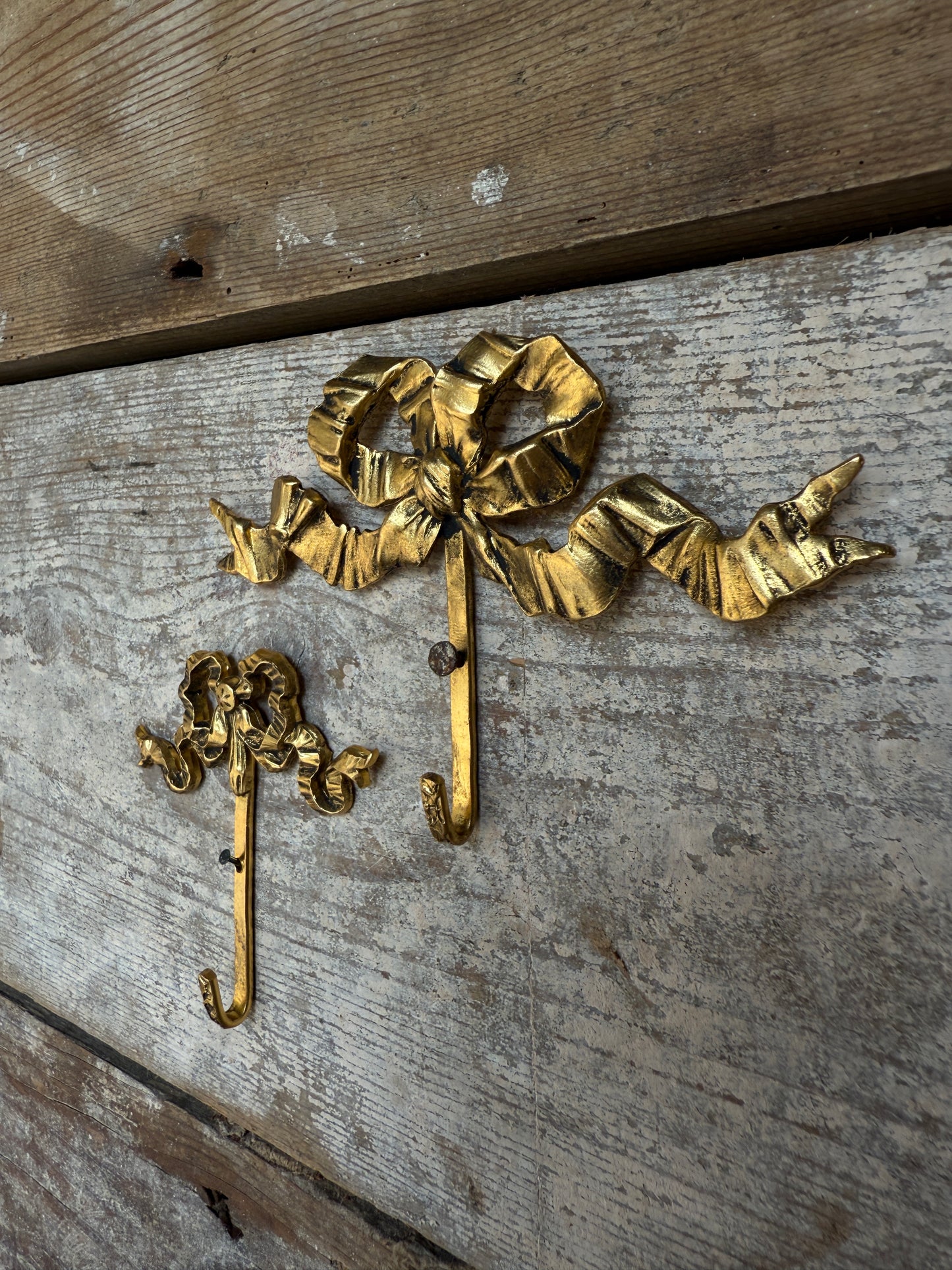 Small vintage French bow hooks