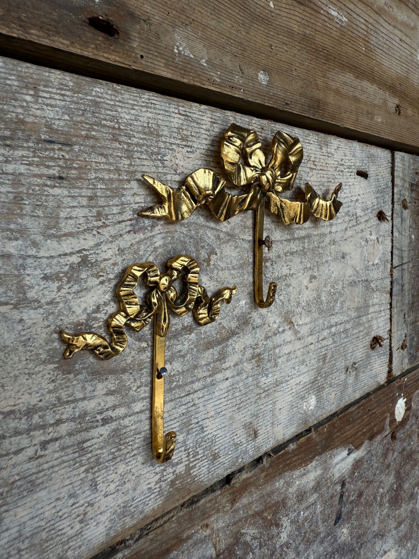 Small vintage French bow hooks