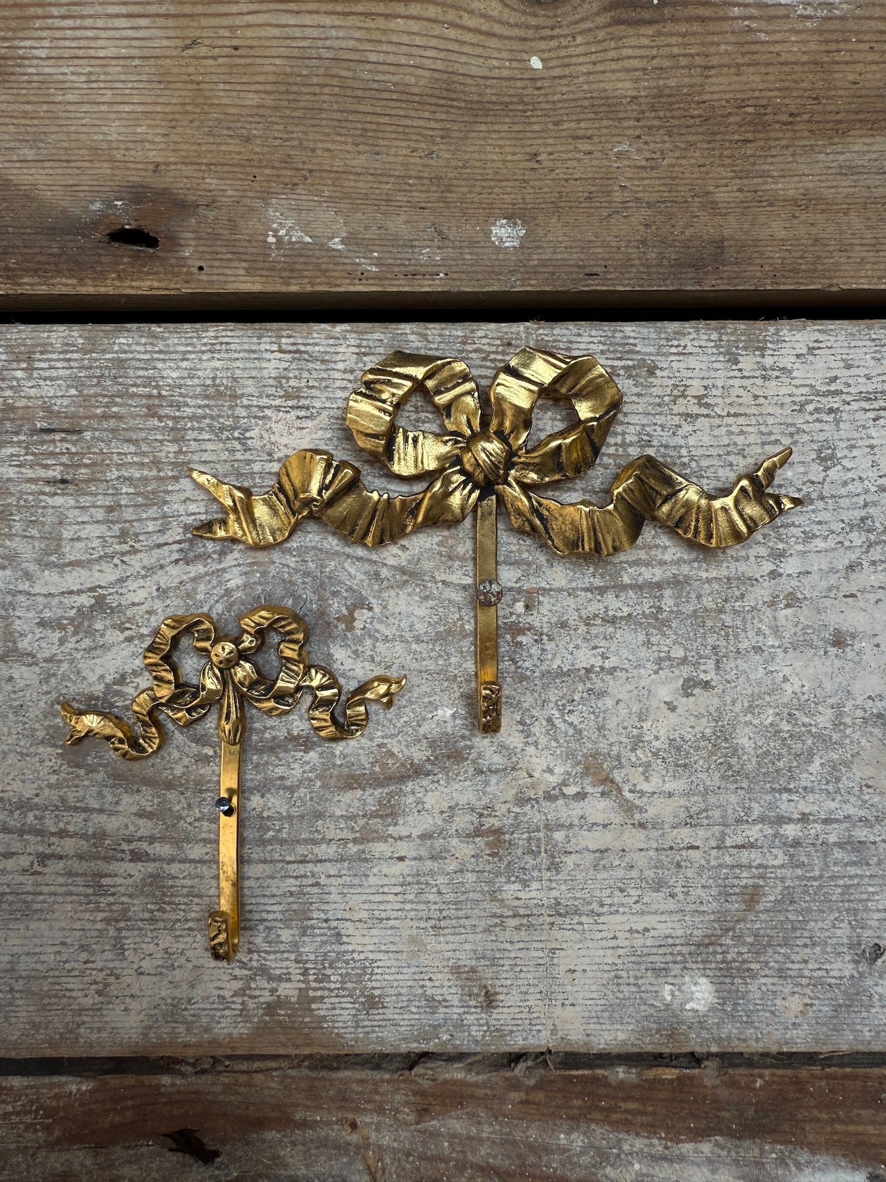Small vintage French bow hooks