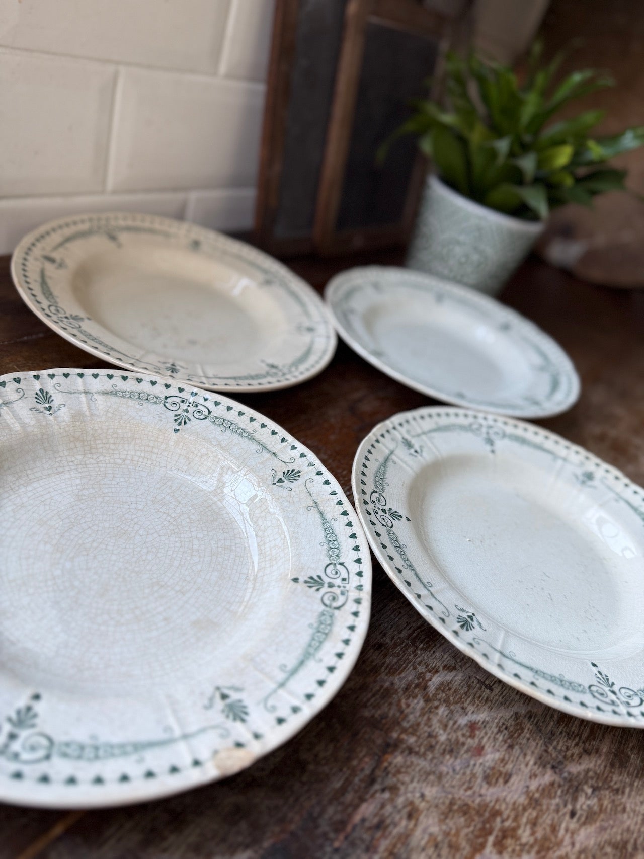 Four pretty vintage French side plates