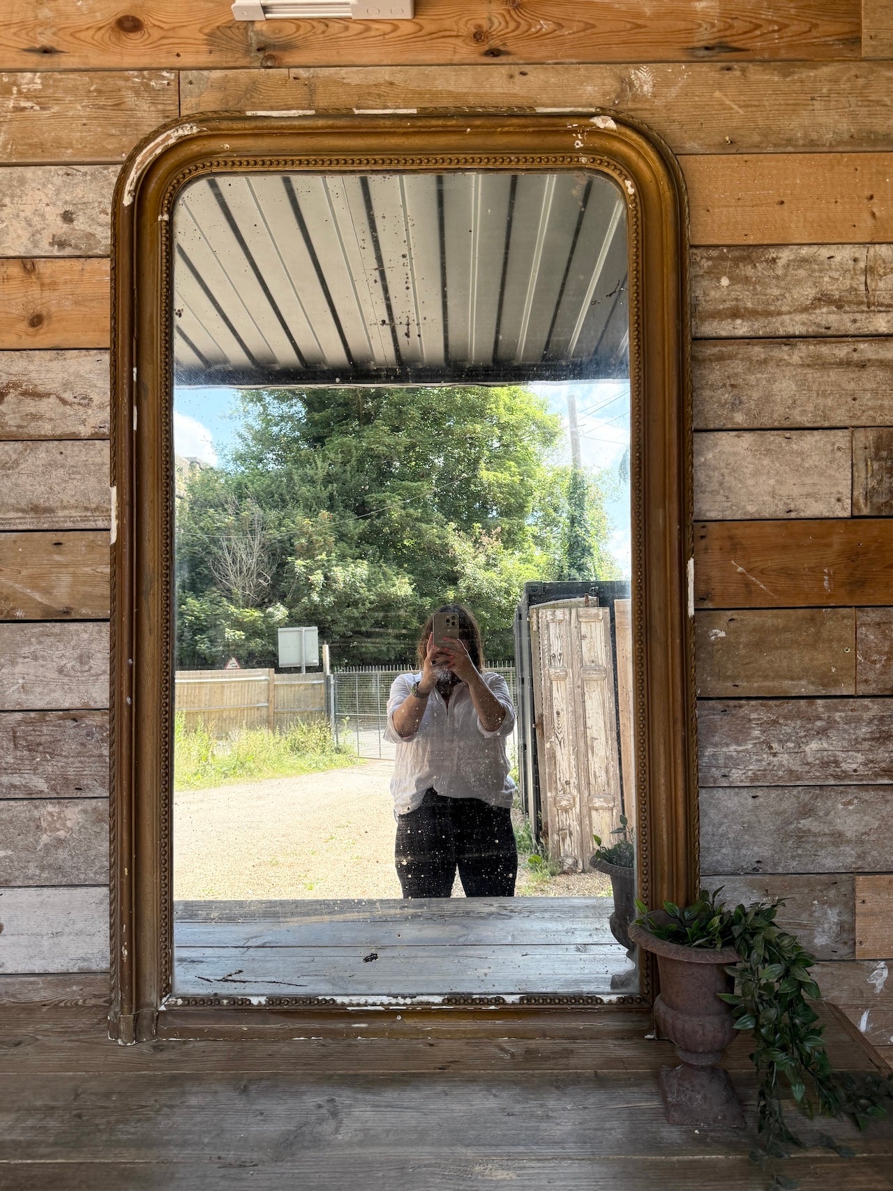 Gorgeous foxed French bronze coloured mirror