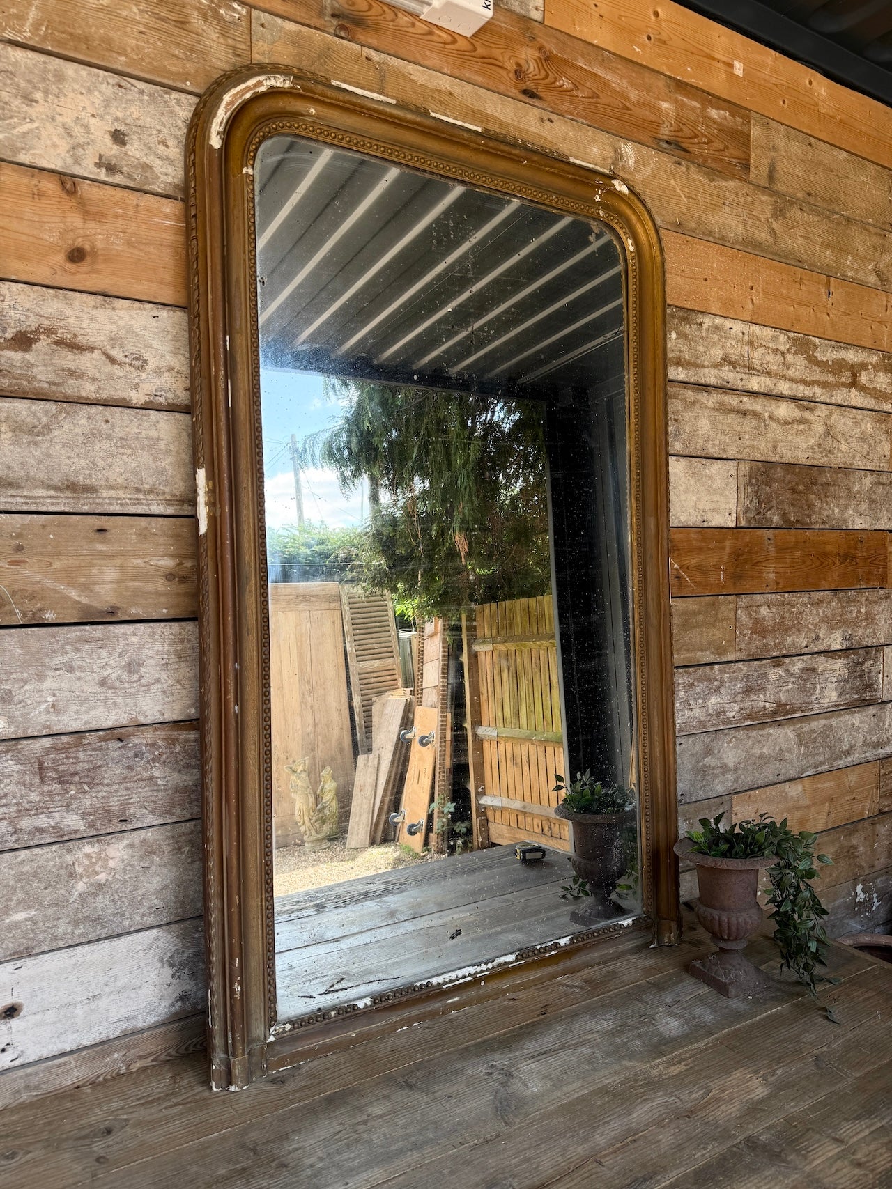 Gorgeous foxed French bronze coloured mirror