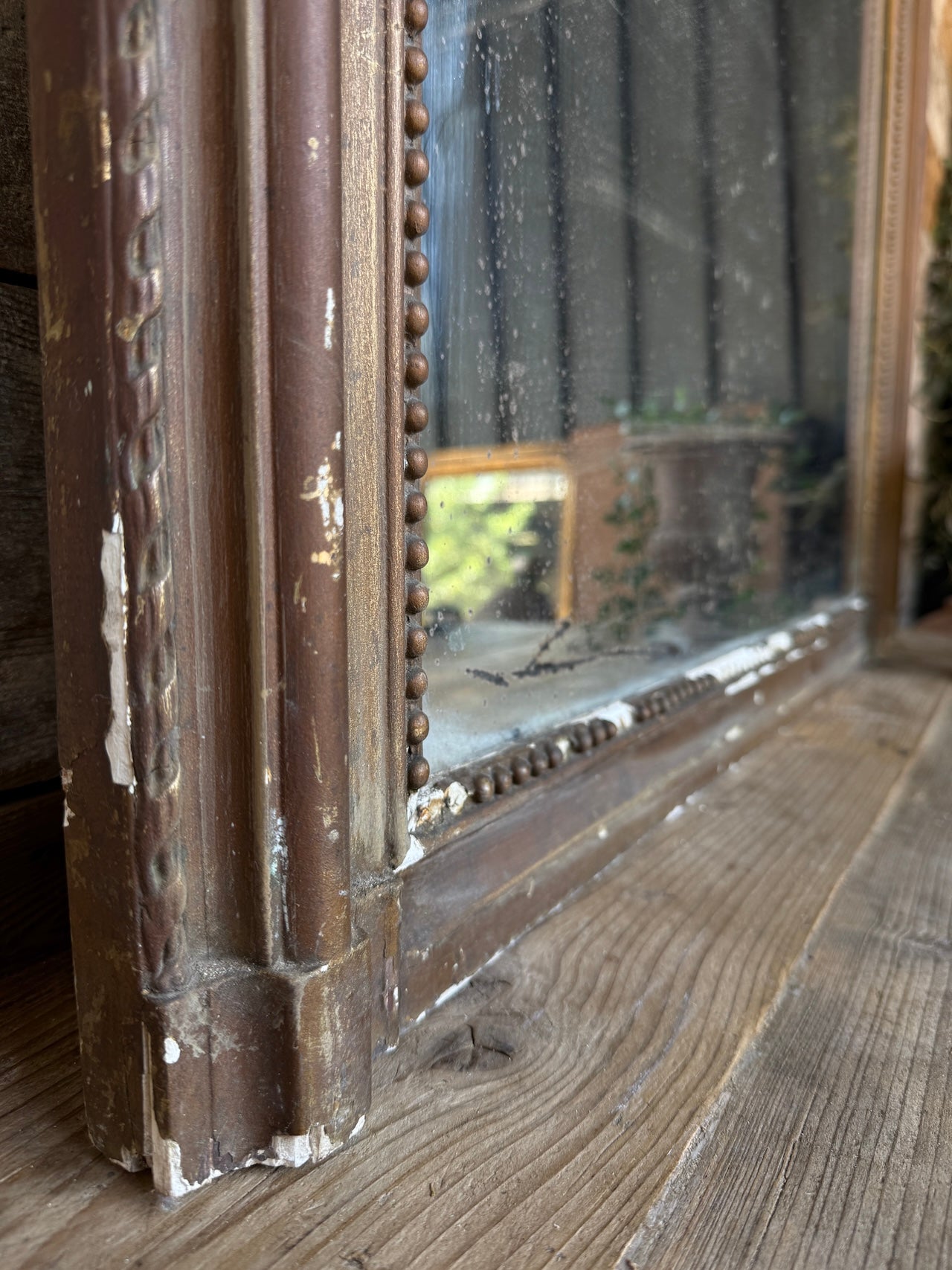 Gorgeous foxed French bronze coloured mirror
