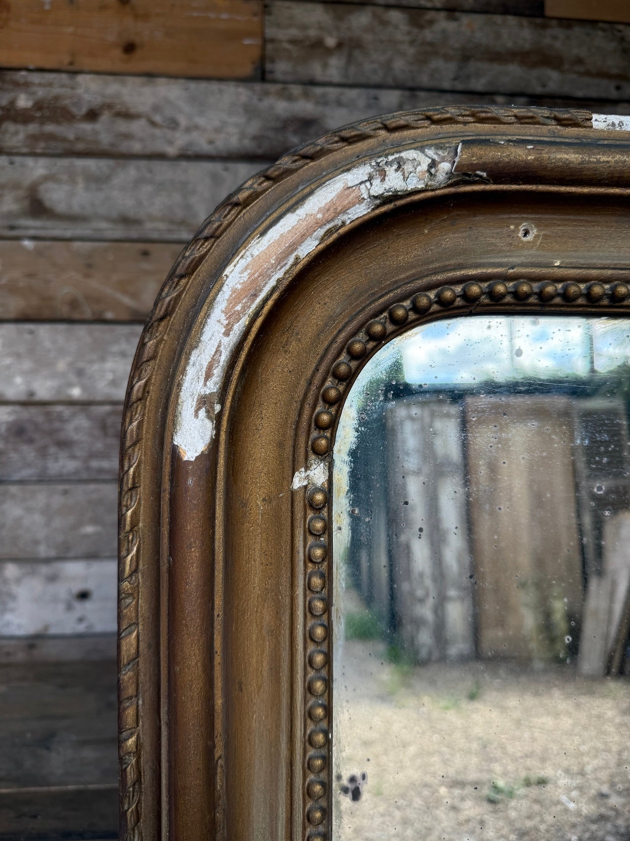 Gorgeous foxed French bronze coloured mirror