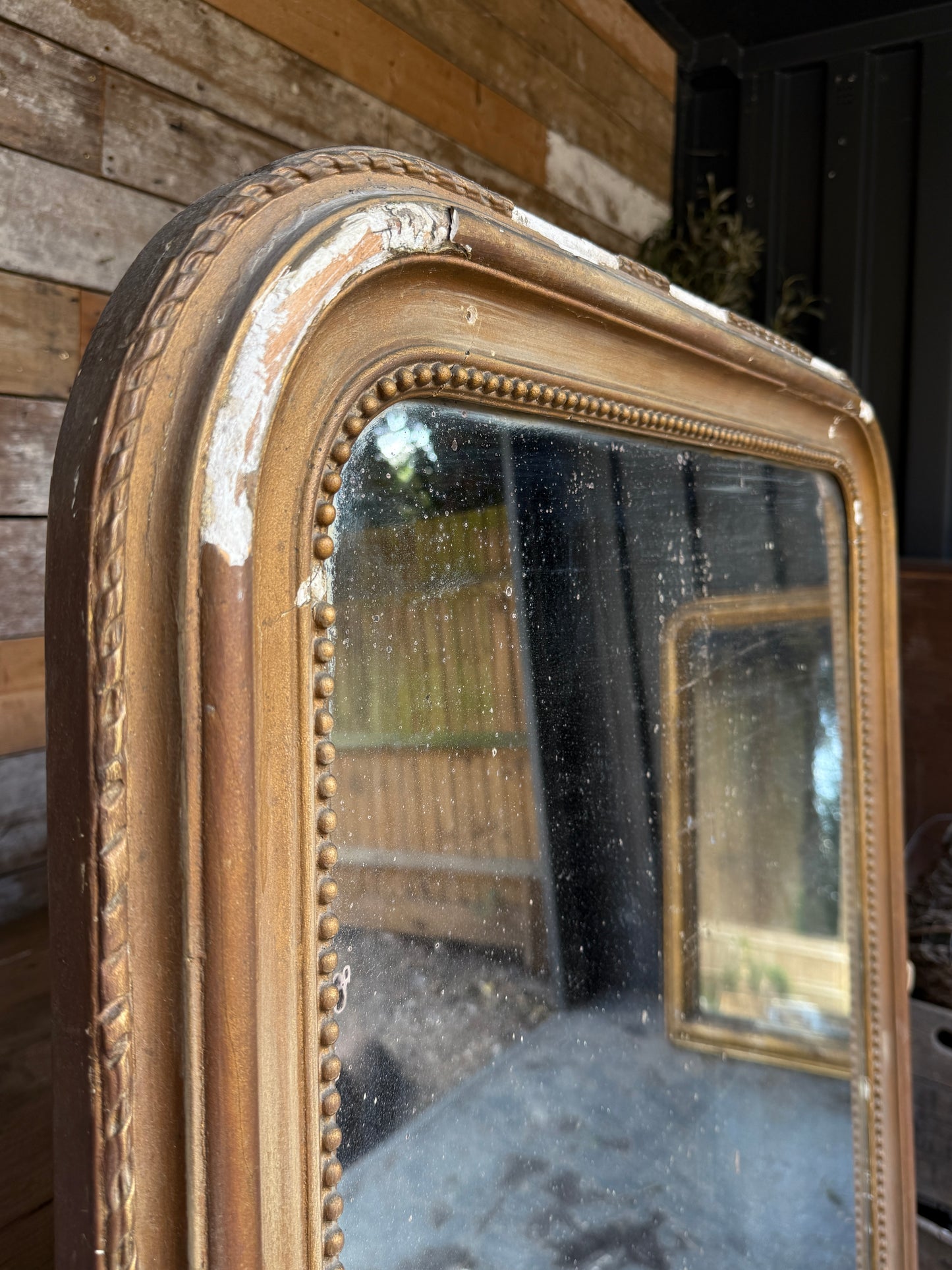 Gorgeous foxed French bronze coloured mirror