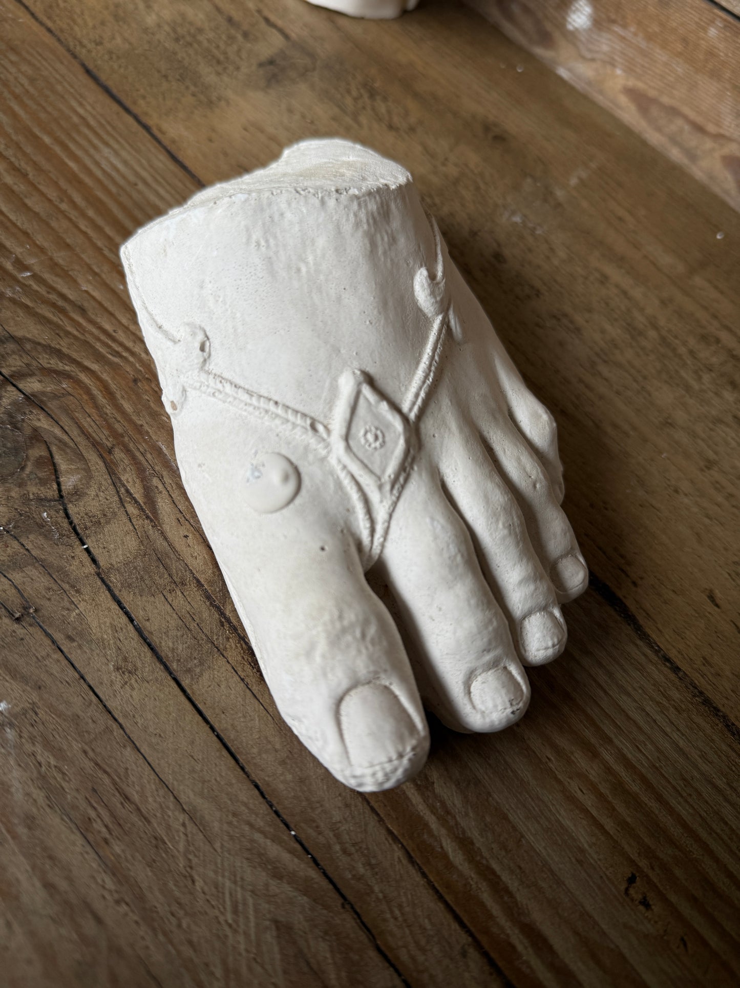 Plaster foot sculpture