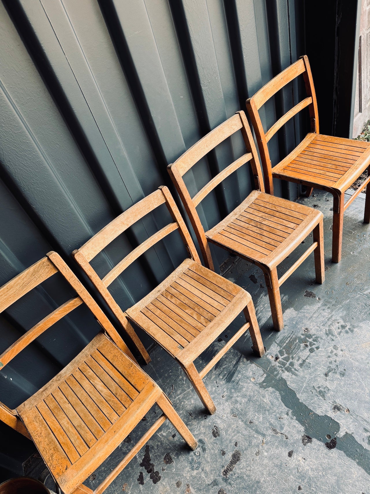 4 mismatched school chairs