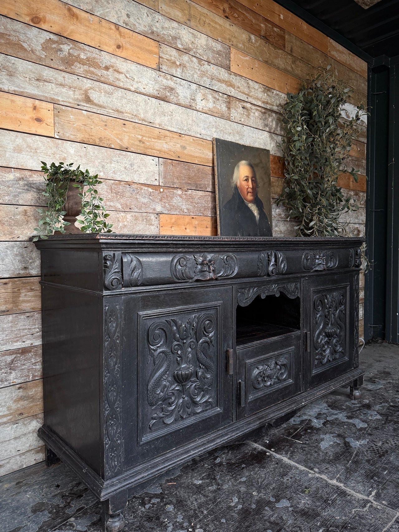 Heavily carved Victorian ebonised sideboard
