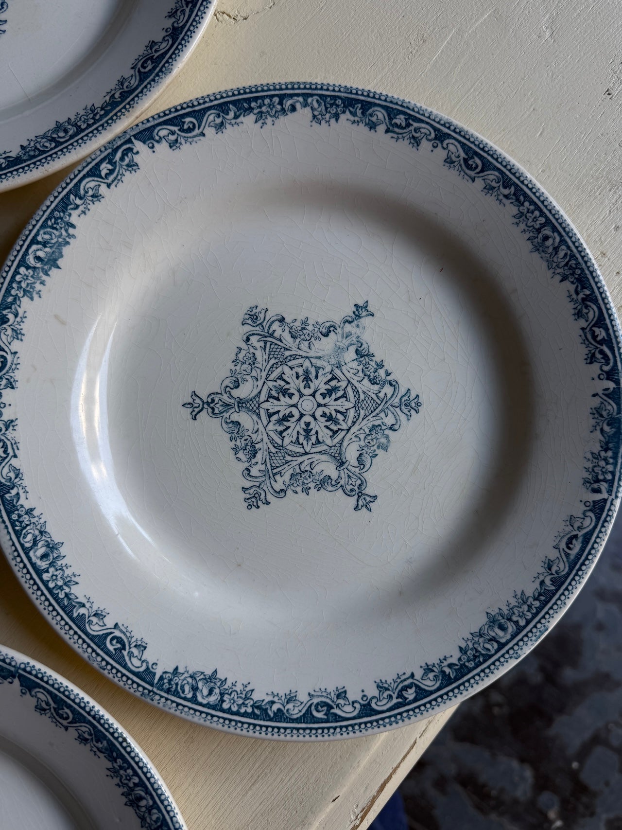 Four pretty vintage French side plates