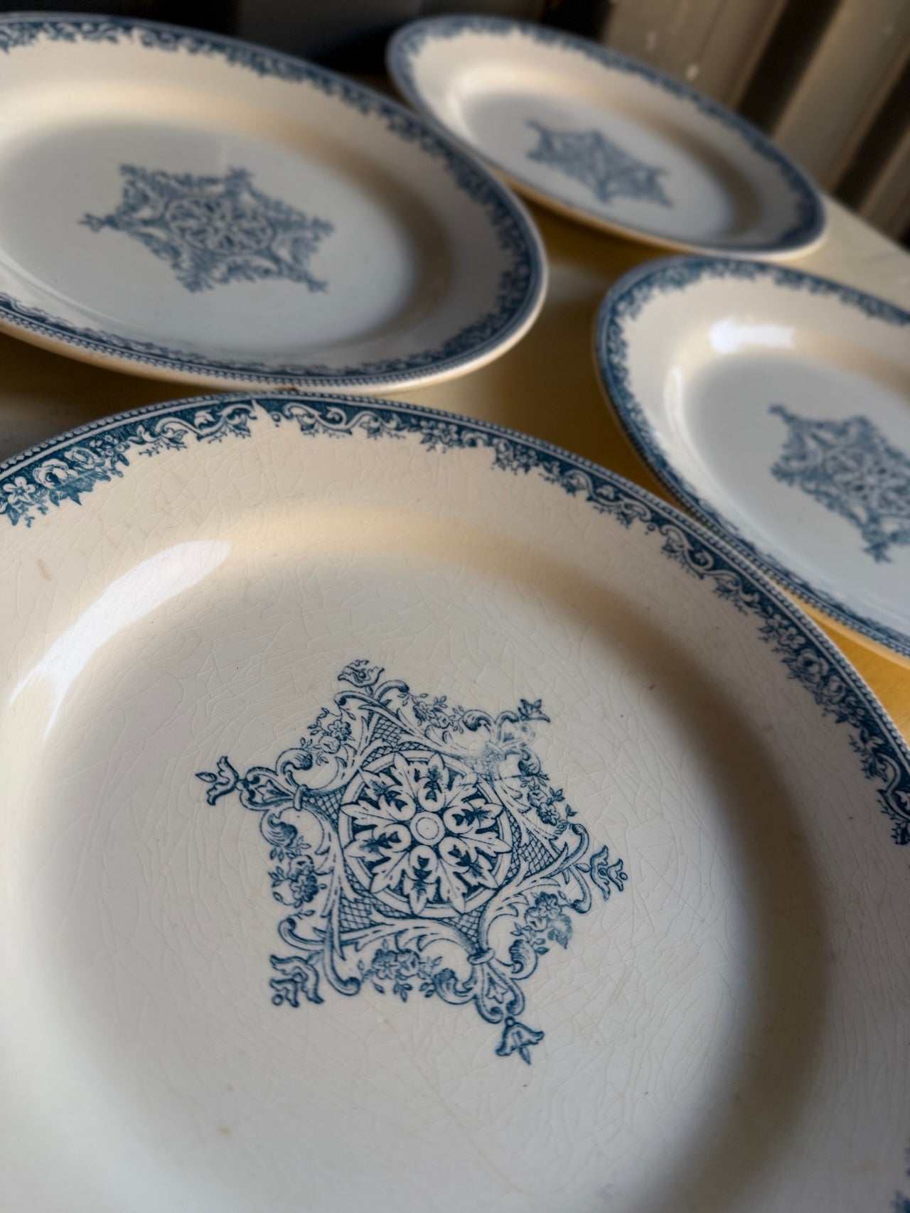 Four pretty vintage French side plates