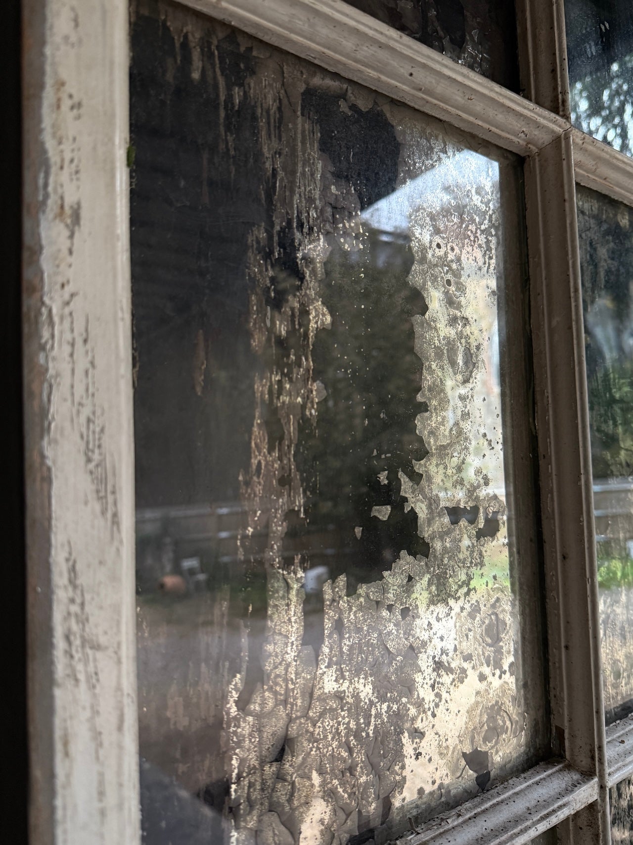 Lovely foxed French mirrored window frame