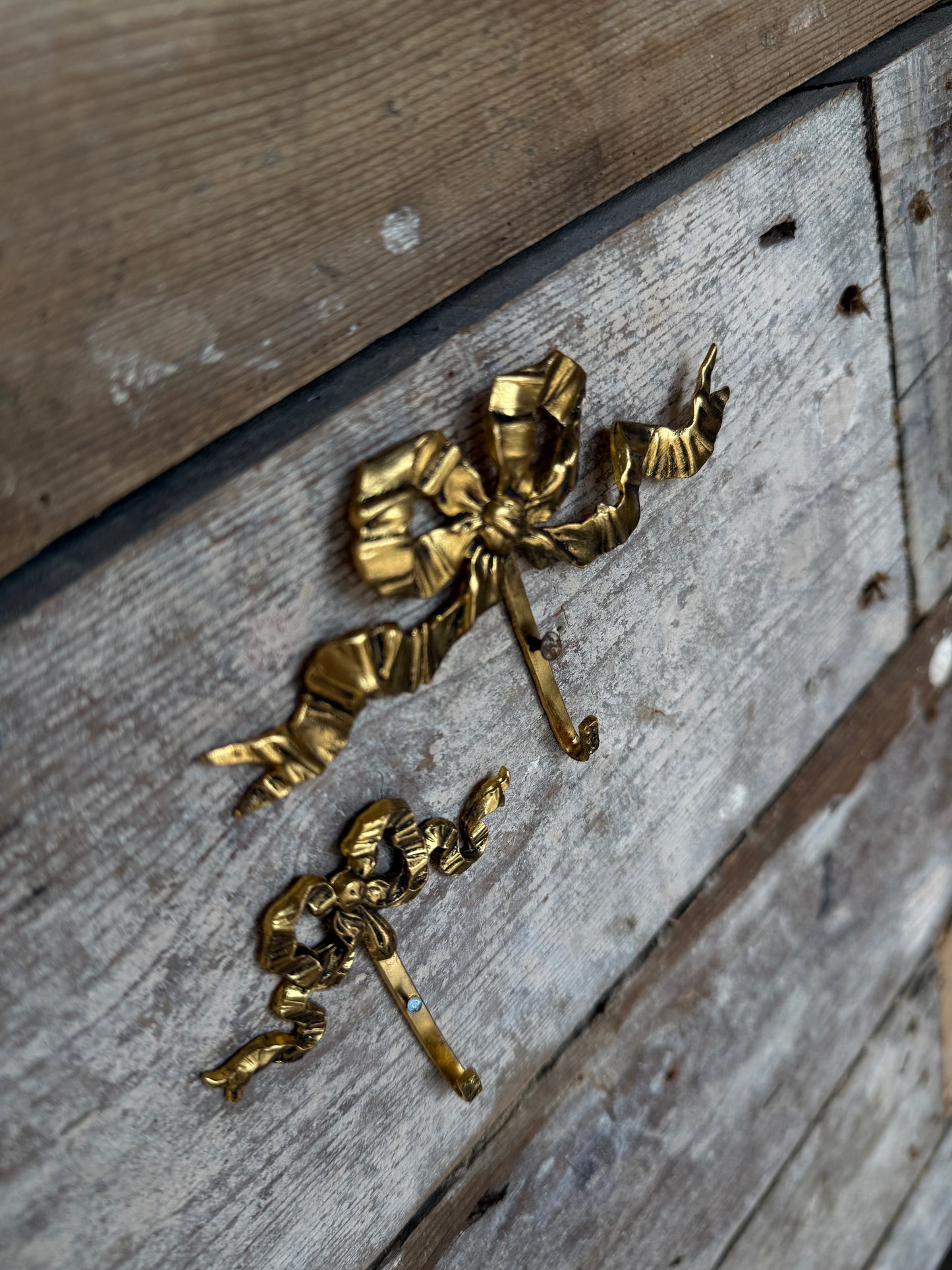 Small vintage French bow hooks