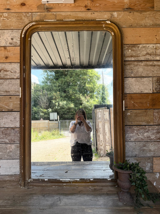 Gorgeous foxed French bronze coloured mirror