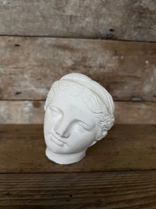 Decorative small plaster head