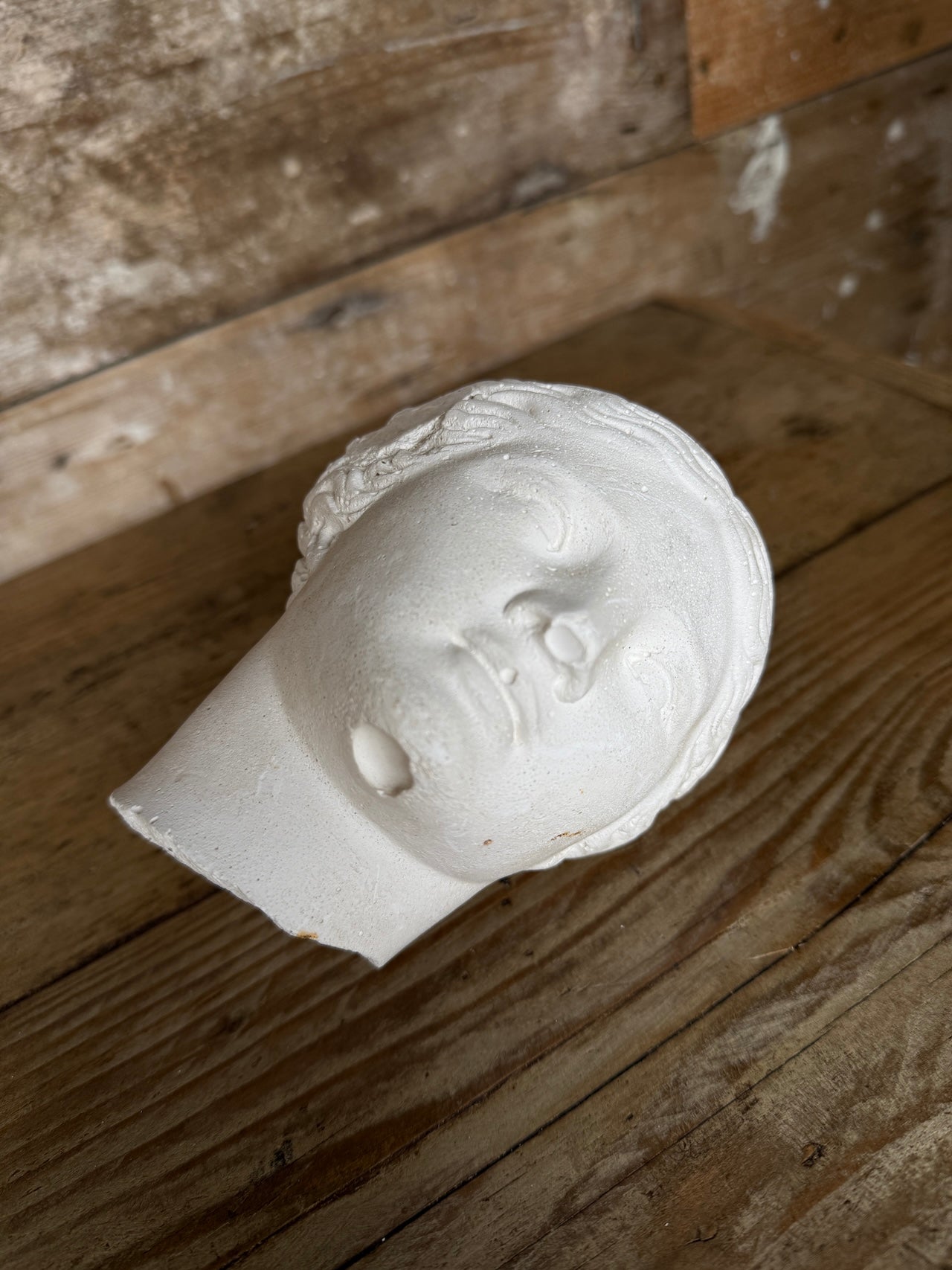 Decorative small plaster head