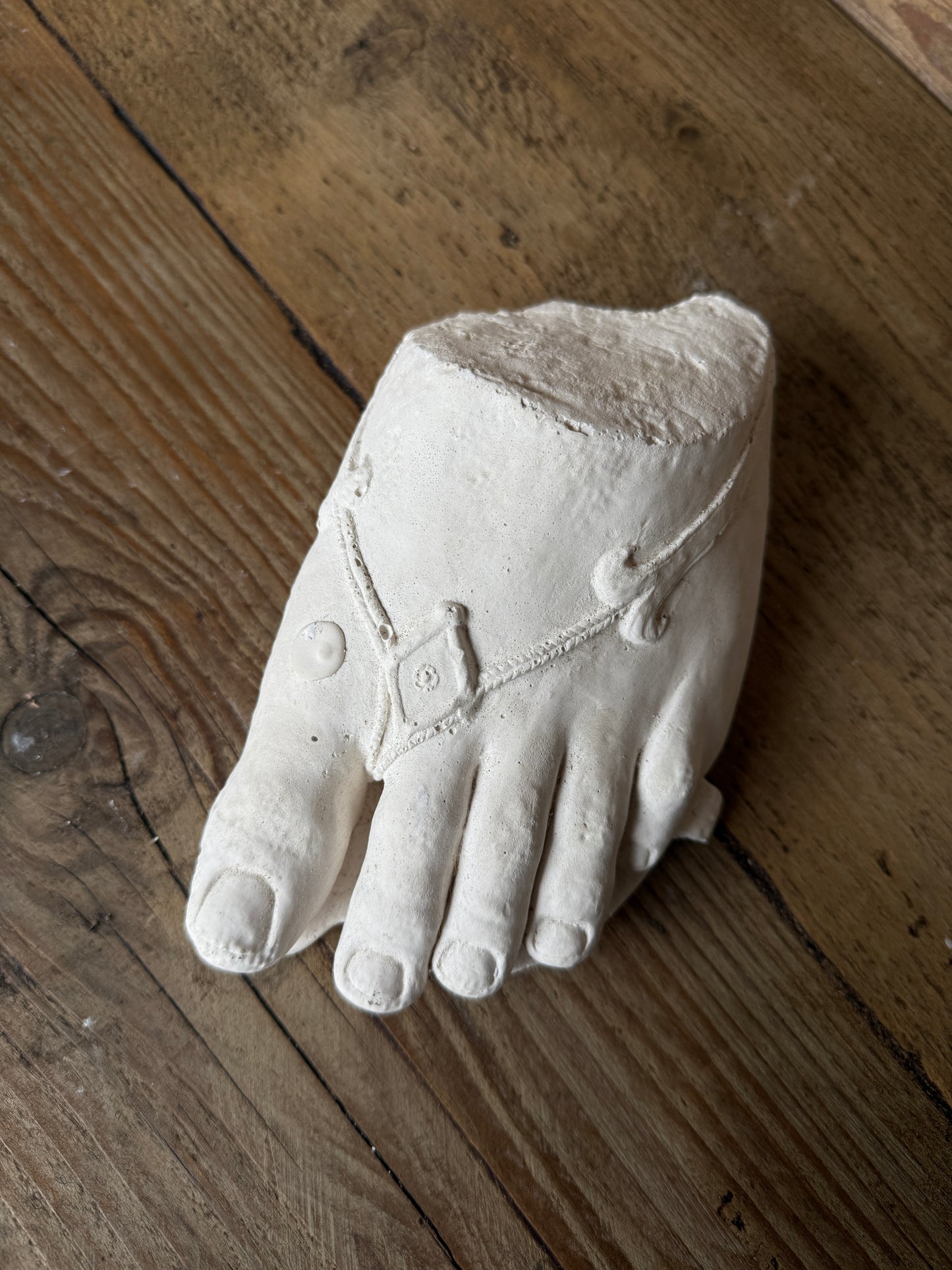 Plaster foot sculpture
