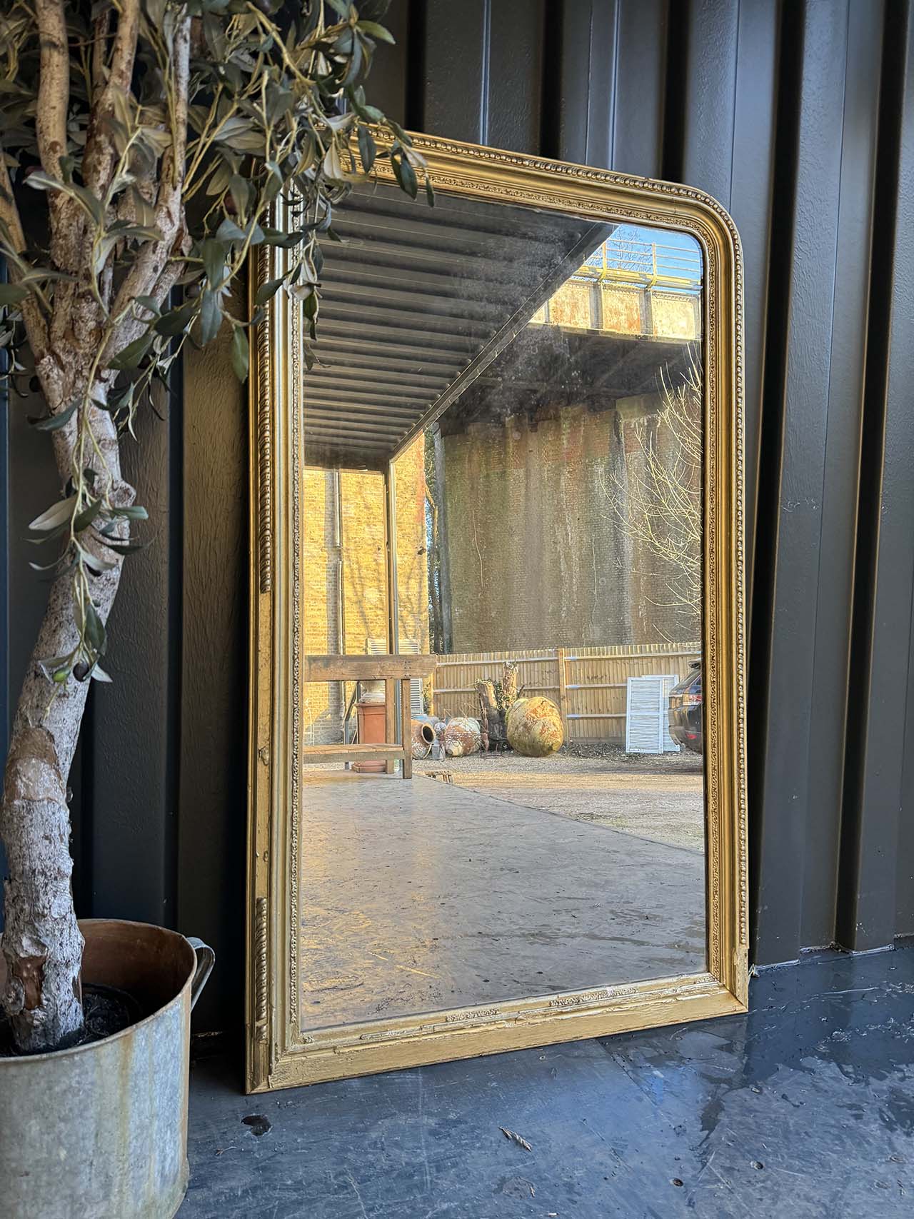 Big French pale gilt mirror